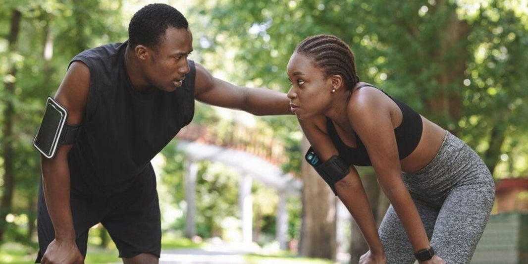 Two athletes gasping during training