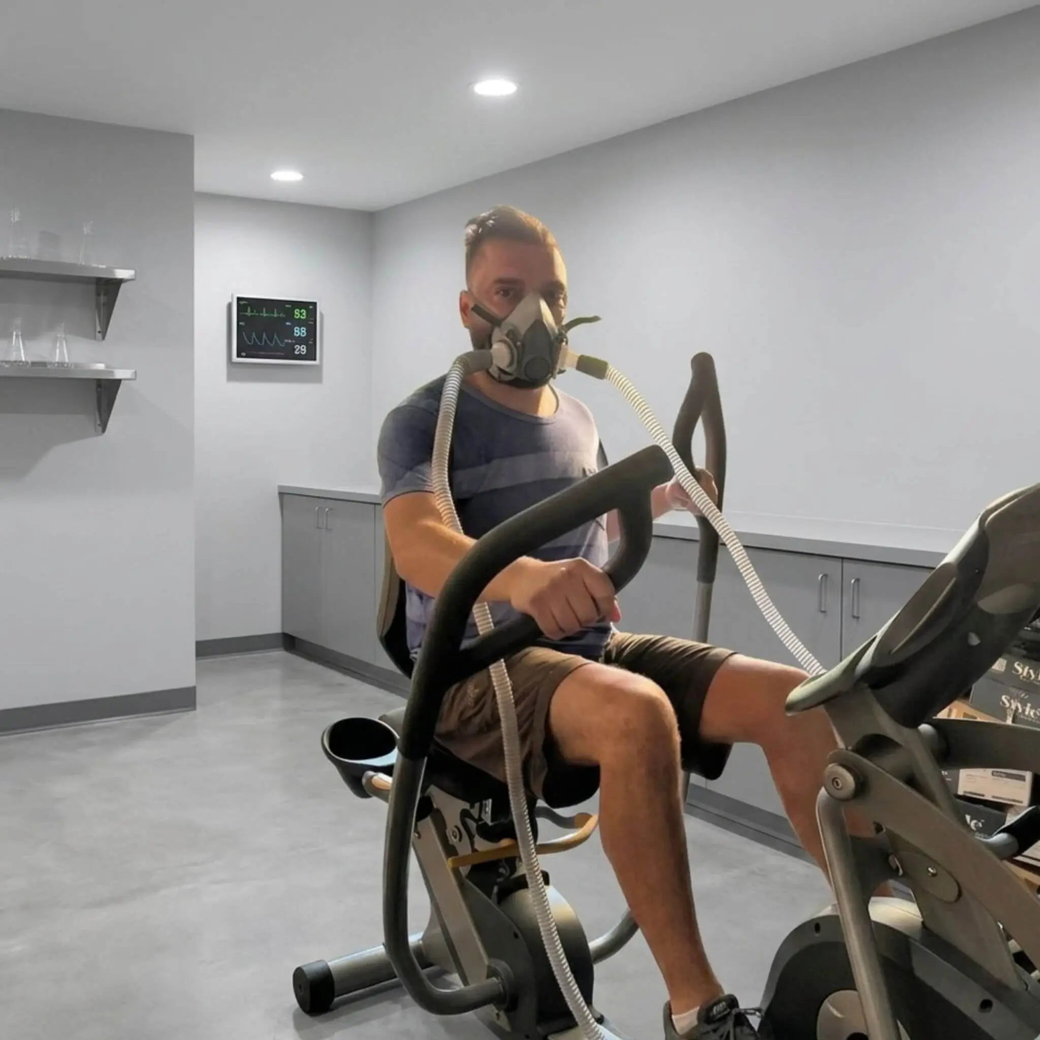 A man exercising wearing the EWOT mask