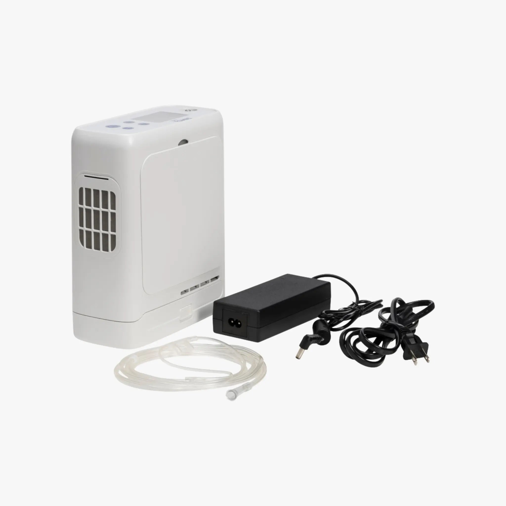 White portable oxygen concentrator with power adapter and cable on a white background