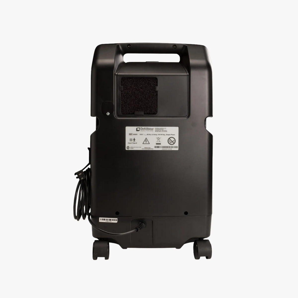 Drive Devilbiss 525DS-Q black portable stationary oxygen concentrator shown from the back, featuring a handle on top, a power cord on the left, and a white specification label in the center, set against a plain light gray background.