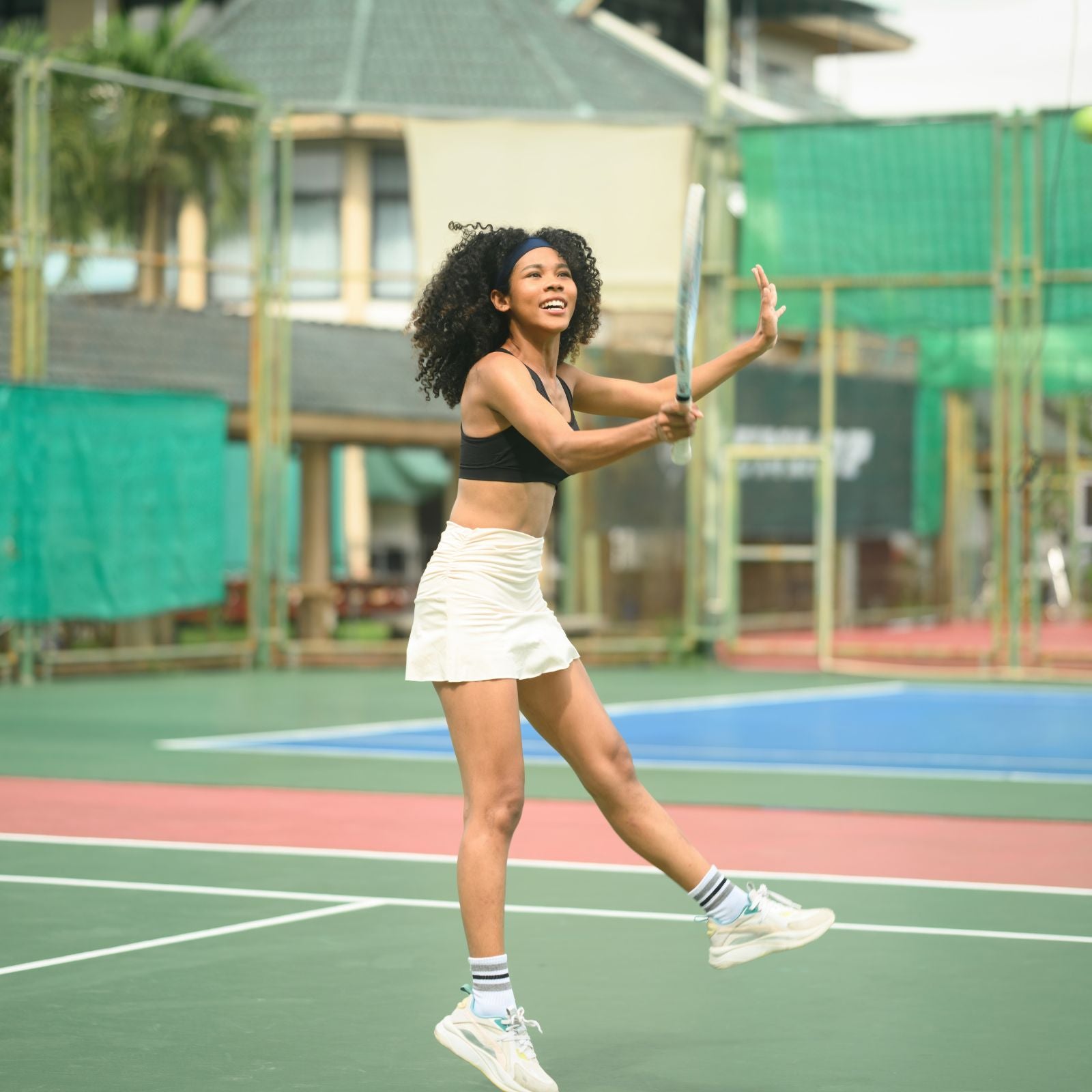 Energetic lady playing tennis