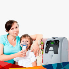 Woman holding a child using an nebulizer with an oxygen concentrator in the foreground.